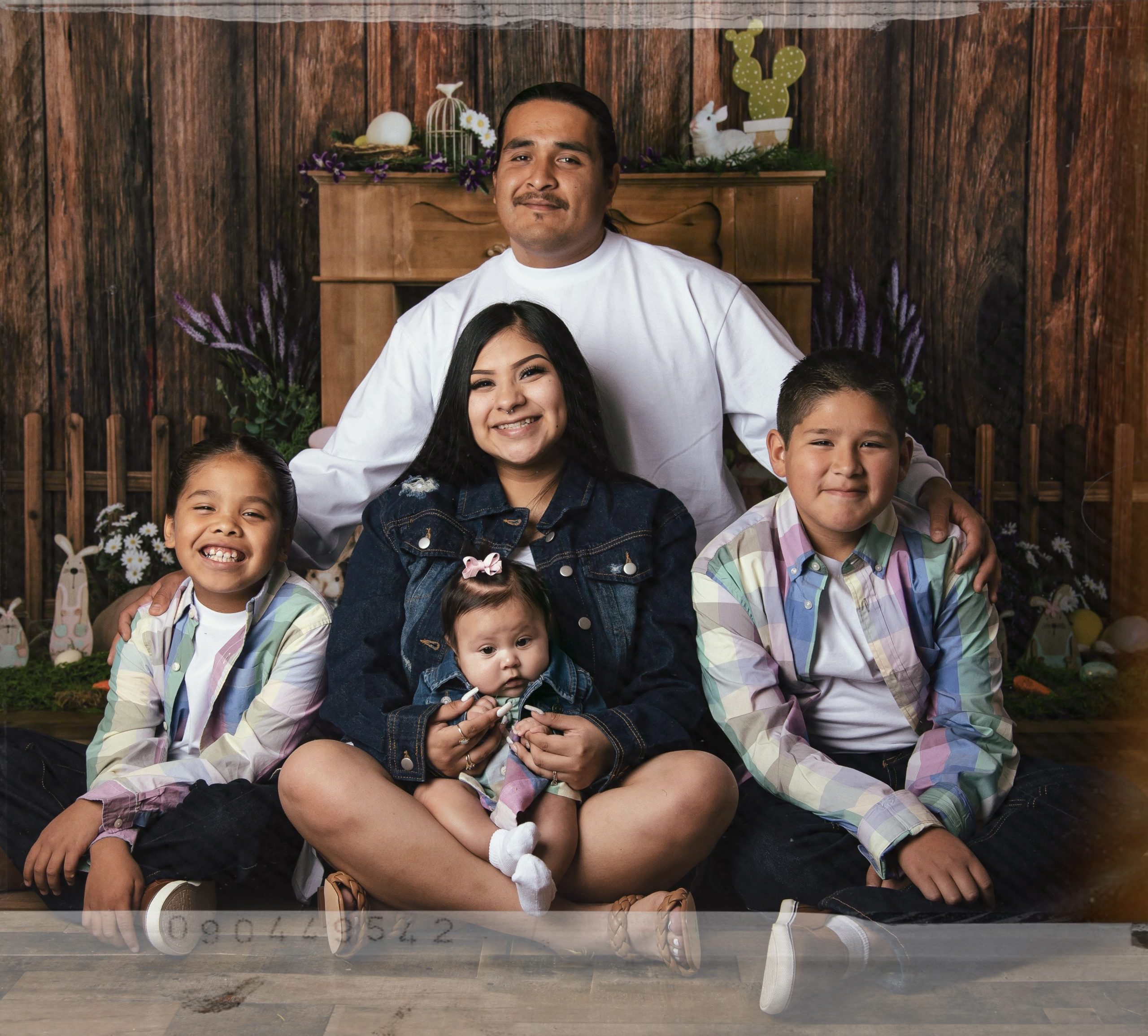 Photo of past awardee, Justina Hunter, smiling with her family around her.